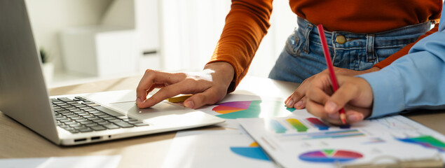 Startup company employee working together, analyzing BI dashboard paper on financial data report...