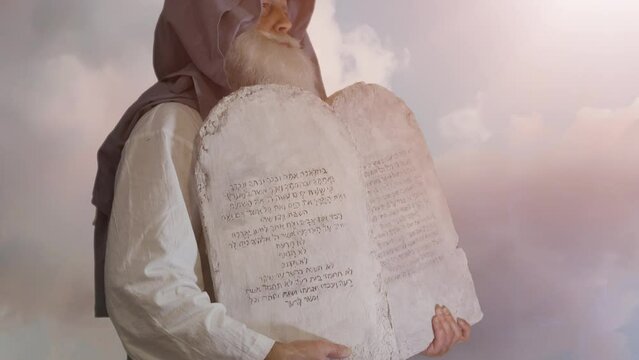The Old Testament biblical prophet Moses holds the tablets with the ten commandments