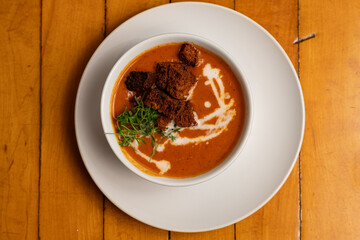 Bowl of tomato soup with croutons