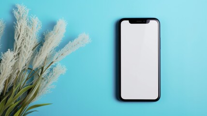 Smartphone with white screen by decorative grass