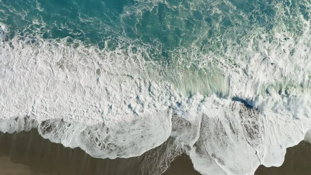The power of a stormy ocean wave seen from above