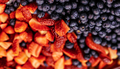 Blueberries and strawberries as a background. Close up. 