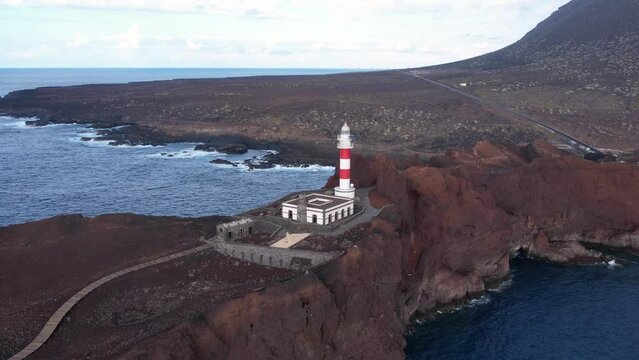 Drone view of Lighthouse Punta Teno on the ocean. Volcanic cliffs of Tenerife, Canary island