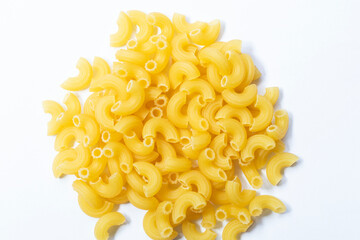 Heap of raw elbow macaroni (Pasta Gomiti) Isolated on white background, Cut with clipping path, Top...