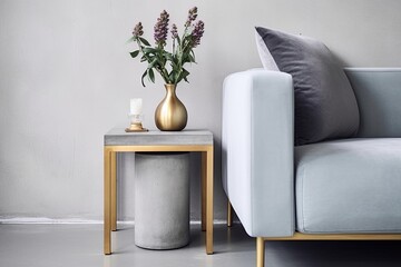 Minimalist Interior: Brass Leg Side Table & Grey Sofa on Concrete Floor