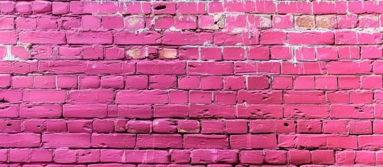 Foto op Plexiglas A close up of a purple brick wall with shades of pink, violet, red, and magenta. The rectangular brickwork creates a textured textile effect © TheWaterMeloonProjec