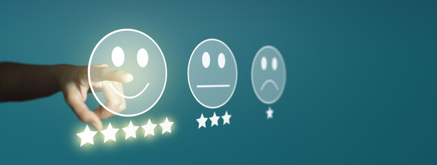 Businessman giving rating with smiley face emoticon on virtual touch screen. Customer satisfaction...