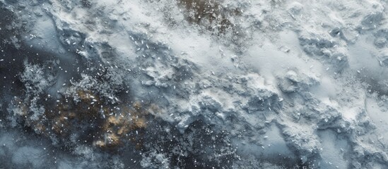 A close up of a freezing winter landscape with a waterfall releasing smoke, creating a stunning contrast between the liquid water and the cold air