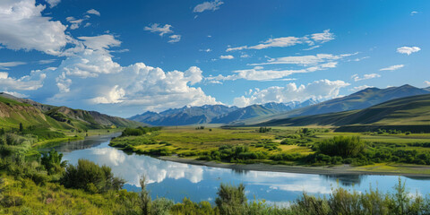 Obraz premium Vast, sprawling landscape, with rolling hills and towering mountains in the distance