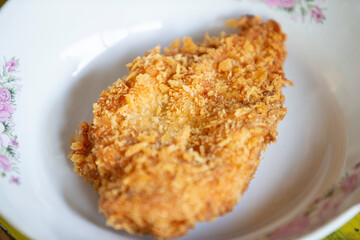 Fried chicken in a pan, close-up, selective focus