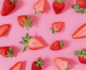 Creative layout made of strawberries on pink background . Flat lay. Fruit concept. Food layout.