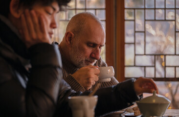 People enjoying tea in teahouse. Seoul, Korea