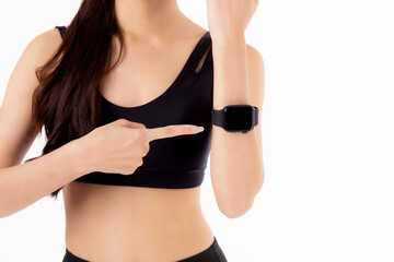 Close-up of a fitness tracker smartwatch on the wrist of a young asian woman wearing a sportswear, isolated white background, fitness tracker on hand woman's wrist, sport concept.