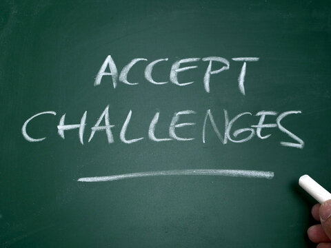 Accept challenges, word text written on chalkboard, motivational inspirational quote