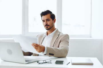 Fototapeta na wymiar Happy suit paper document businessman company planning office holding laptop