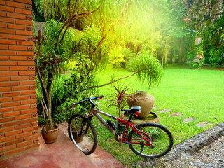 Bicycle parked on front yard of buildings, house