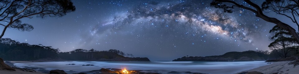 Starry Night Sky over Tranquil Beach with Campfire