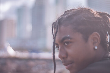 17 year old afro descendant teenager with braids in hair and no shirt, various facial expressions,...