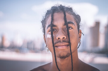 17 year old afro descendant teenager with braids in hair and no shirt, various facial expressions,...