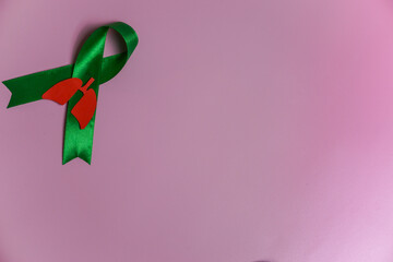 red lung and green ribbon on pink background, for world TB day March 24, world no tobacco day, lung cancer