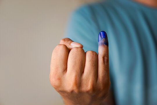 portrait of a man who shows his little finger when he has voted, concept of presidential election indonesia