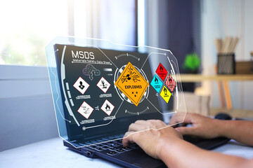 Material safety data sheet MSDS with staff on laptop computer to down load dangerous chemical...