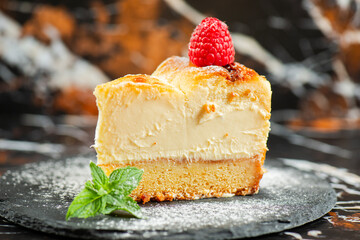 Delicious soft-baked creamy Patterson cheesecake with a spongecake base. - obrazy, fototapety, plakaty