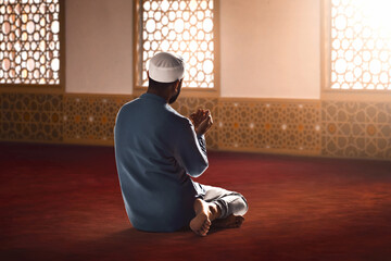 Young asian muslim man with beard praying in the mosque - 739690650