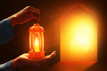 Hands of young asian muslim man holding shiny arabic lantern in the mosque door arch at beautiful sunset - 739691434