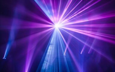 Fototapeta premium Blue and violet beams of bright laser light shining on black background