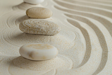 Zen garden with stones and sand, invoking tranquility