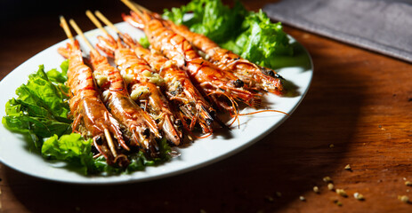 Grilled shrimp skewers on a plate	