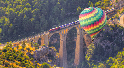 Hot air balloon flying over Varda Railway bridge - Adana, Turkey