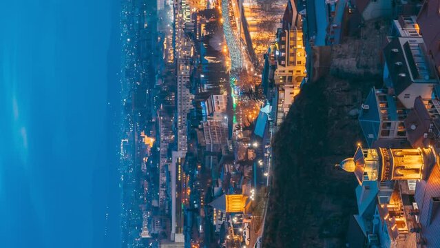 Tbilisi, Georgia 4k Timelapse. City During Sunset And Night Illuminations. Elevated Top View Of Famous Landmarks In Night Illuminations. Beautiful Heaven. Cityscape From Midday To Night. Scenic View