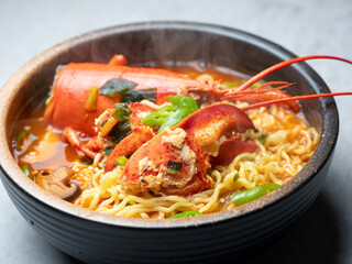 Spicy ramen with lobster in a bowl