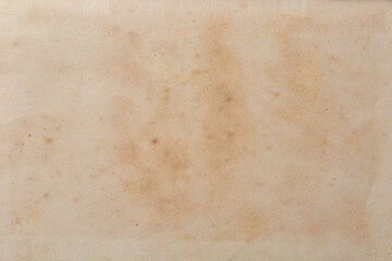 abstract of old discolored book page background, historical and vintage faded with spots or stain...