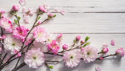 Fototapeta na wymiar Pink Petal Parade: Flat Lay of Spring Flowers on White Wood