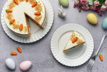 Homemade Easter carrot cake made with walnuts, iced with cream cheese. Sweet dessert.