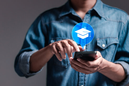 E-learning education concept, person use smartphone with E-learning icon on virtual screen. learning online with webinar, video tutorial, internet lessons.