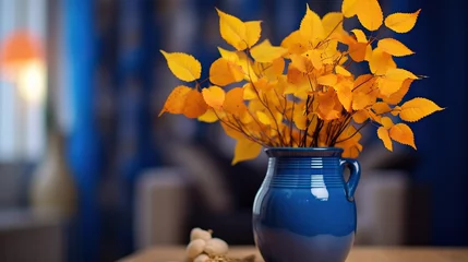Sierkussen Autumn still life with yellow leaves in a blue vase © Daisha