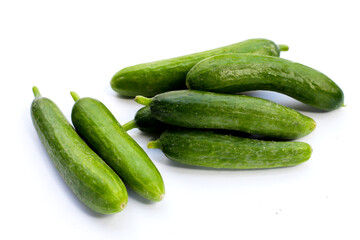 Mini cucumbers on white background.