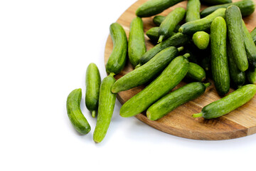 Mini cucumbers on white background.