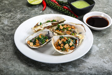 Open half oysters with green onion