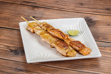 Grilled salmon skewer with sauce