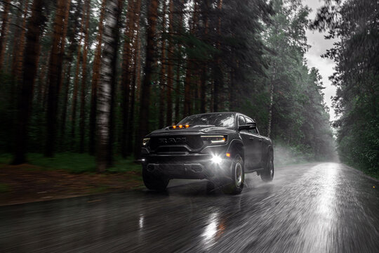  Novosibirsk, Russia - July 27, 2023:  blue  Dodge Ram Trx Havok Edition, pickup  driving   on the street on a warm day against the backdrop of a forest