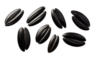 Schilderijen op glas A Bunch of Black Sunflower Seeds. A photo featuring a gathering of black sunflower seeds arranged neatly. on a White or Clear Surface PNG Transparent Background. © Usama