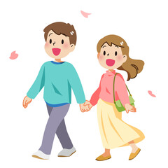 春に桜を見ながら散歩するカップル