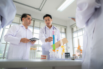 Fototapeta premium A medical professor is lecturing on a case study related to disease treatment to medical students