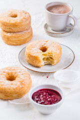 Cronuts - delicious fusion of croissant and donut with raspberry jam.