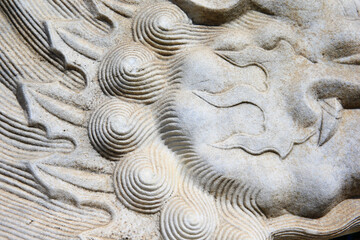 Vintage ornament on the stone. Close-up seamless texture. Stone texture. Embossed pattern.